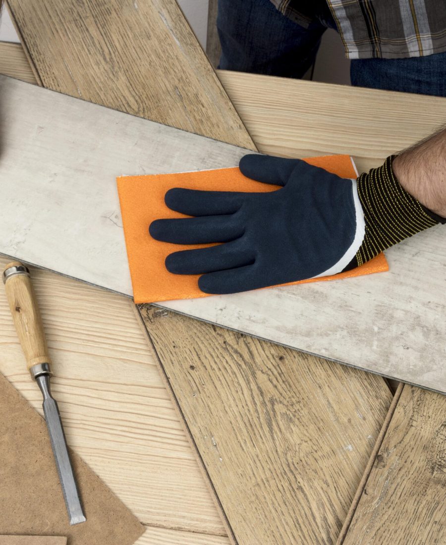 top-view-man-using-sand-paper-carpentry-workshop-concept